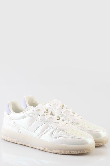 white sneakers by blue jean traders with beige sole and purple heel tab