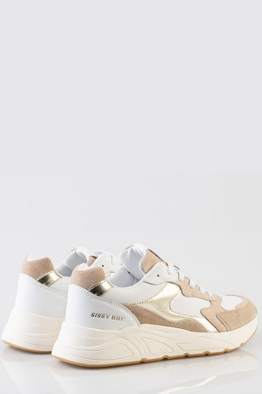 white and beige chunky sneakers with gold metallic accents and thick cream sole side view