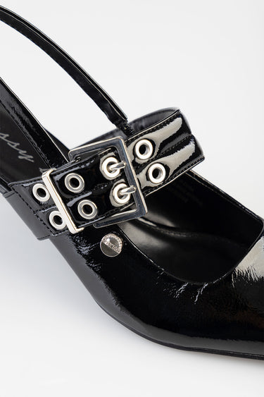 black patent heeled sandal with a wide strap and double buckle with metal eyelets