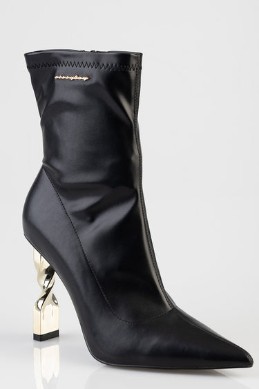 black leather ankle boot with pointed toe and twisted gold metal heel