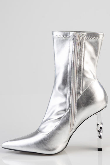 silver metallic ankle boot with a side zipper, pointed toe, and sculpted clear heel