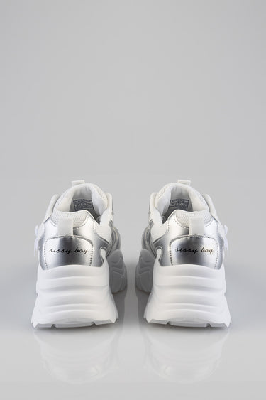 pair of white and silver chunky sneakers from blue jean traders, rear view with sissy boy on the heels