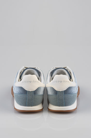 blue jean traders sneakers shown from the back, light blue denim uppers, white heel patches with stitched branding, gum