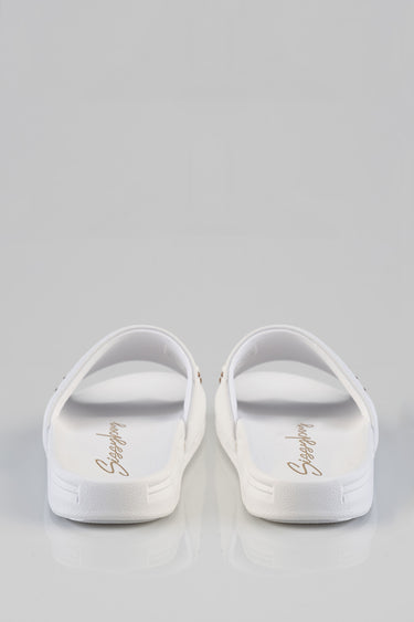 white paula slides by blue jean traders, back view showing white straps and textured sole
