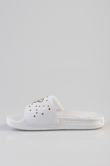 white slide sandal with a studded strap and cushioned footbed
