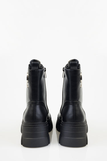 blue jean traders black leather ankle boots shown from the back with thick rubber platform soles and side zippers