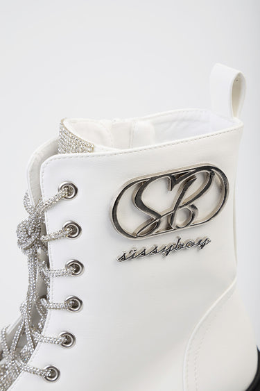 white ankle boot with silver rhinestone laces and a metallic logo emblem on the side, with a back pull tab