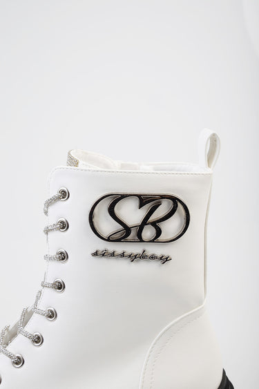 white ankle boot with lace up front, silver eyelets, pull tab at back, and a metallic logo on the side