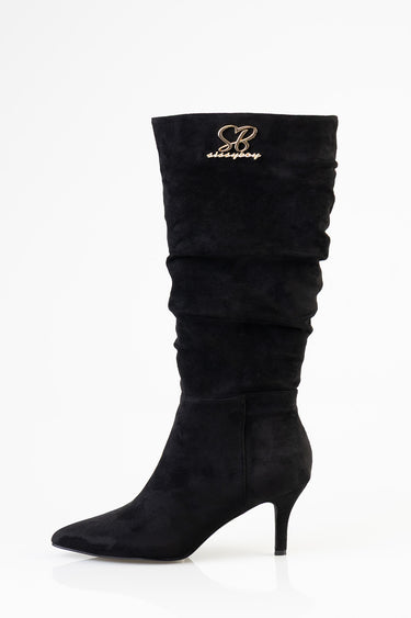 black suede knee high boot with ruched shaft, pointed toe, and gold emblem at the top
