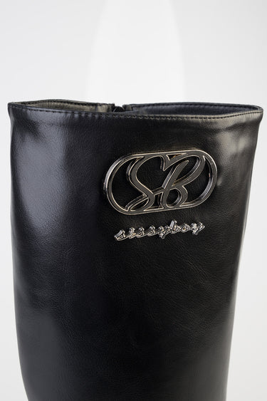 black leather tall boot by Blue Jean Traders with a silver monogram badge on the shaft