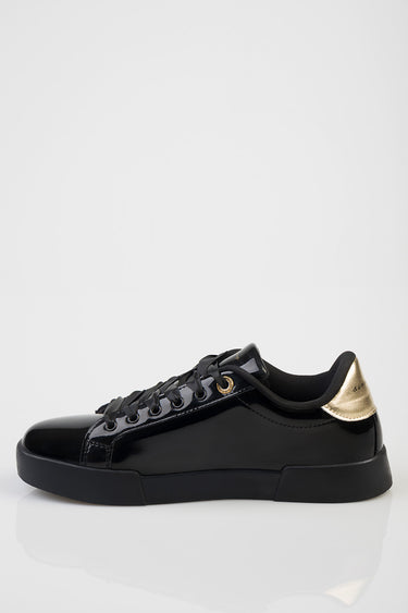 black patent sneakers with gold metallic heel by Blue Jean Traders, black laces and a thick sole