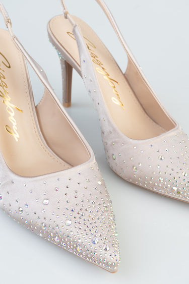 nude pink high heels with pointed toes and crystal rhinestone embellishments.