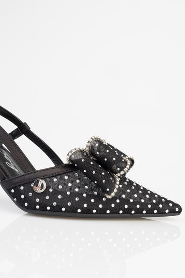 black slingback heel with white polka dots and a rhinestone bow detail
