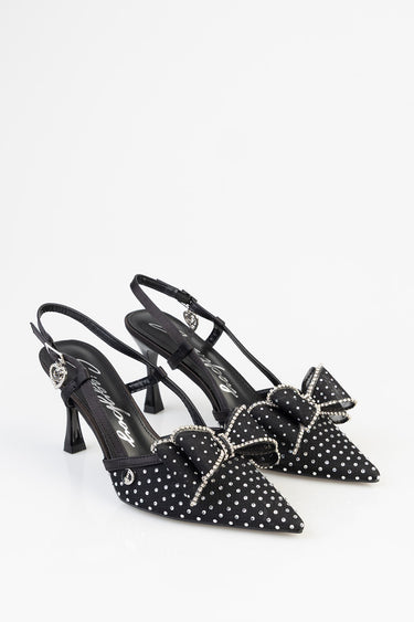 black polka dot slingback heels with pointed toes and sparkling bow embellishments and heart charms