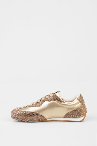 gold sneakers with rhinestone encrusted toe and heel, metallic side panels and white sole