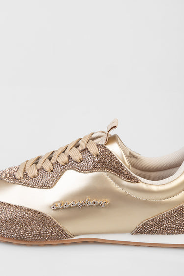 gold metallic sneaker with rhinestone encrusted panels and beige laces, low profile with tan sole