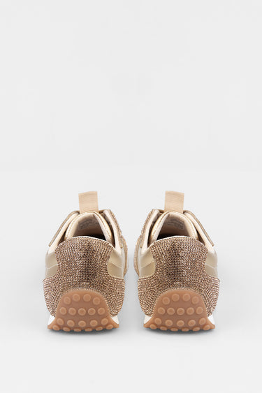 rear view of gold glitter sneakers with beige panels and pull tabs