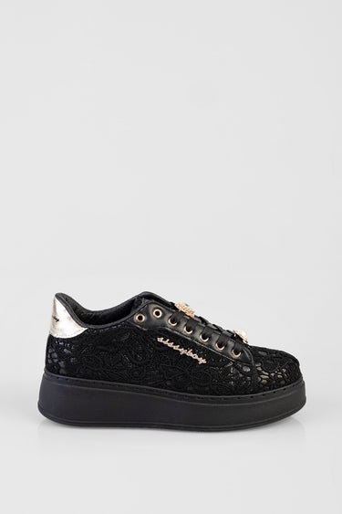 black lace sneakers with a thick black platform sole and gold accents including eyelets and a metallic heel patch
