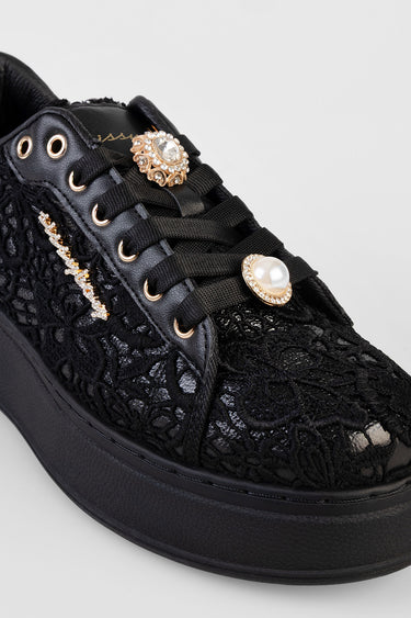 black lace sneaker with gold eyelets and jeweled brooches on the laces, blue jean traders