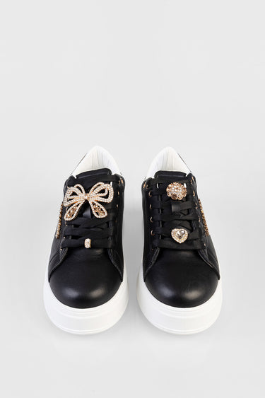 Blue Jean Traders sneakers in black with white sole and crystal bow decorations on the laces