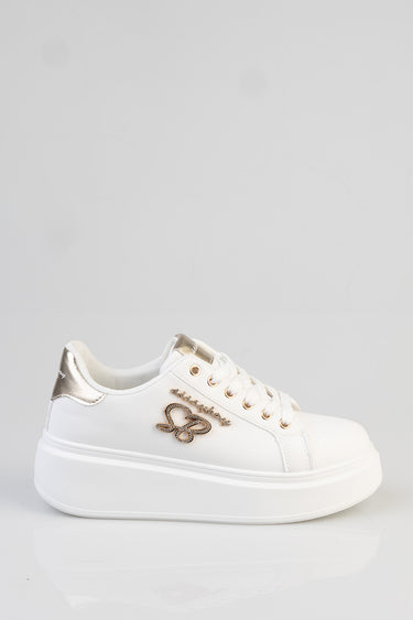 white platform sneaker with a gold metallic heel panel, white laces, and a cursive logo on the side