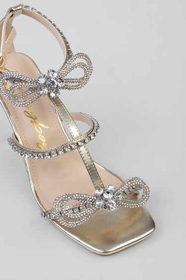 silver high heel sandal with crystal bow and rhinestone straps and square toe