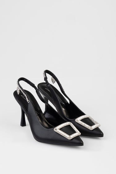 black slingback heels with pointed toe and square crystal buckle detail