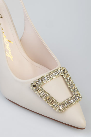 cream slingback heel with a rectangular crystal buckle on the pointed toe