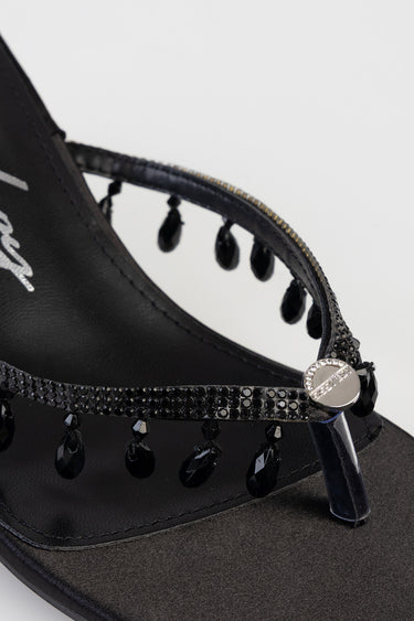 black high heel sandal with rhinestone embellished strap and dangling bead accents