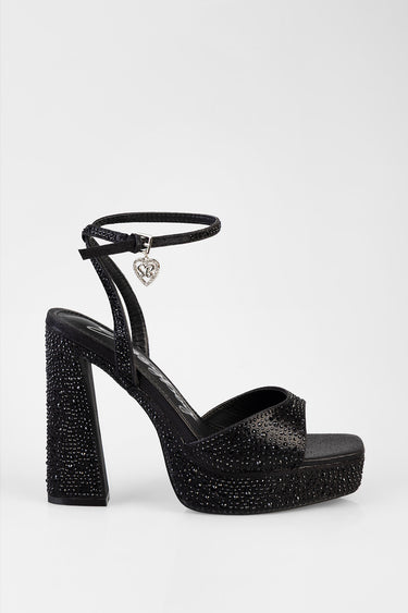 black glitter platform heel with ankle strap and heart charm pendant with rhinestone detailing