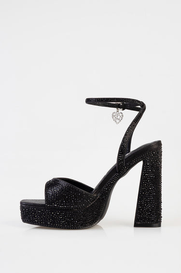 Blue Jean Traders black glitter platform heel with ankle strap and heart charm.