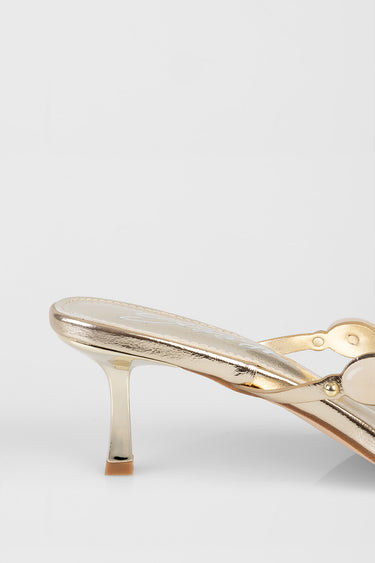 gold metallic heeled sandal with thin transparent heel and strap details