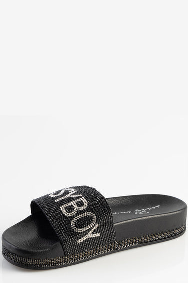 black slide sandal with a wide rhinestone strap and textured sole