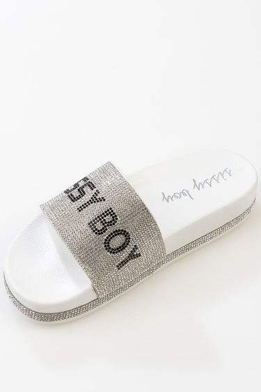 blue jean traders silver rhinestone strap slide sandal on a white footbed with the logo visible