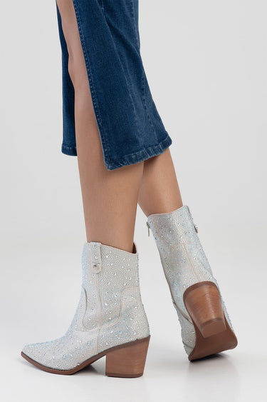 blue jeans paired with silver glitter mid calf boots with a wooden block heel by blue jean traders