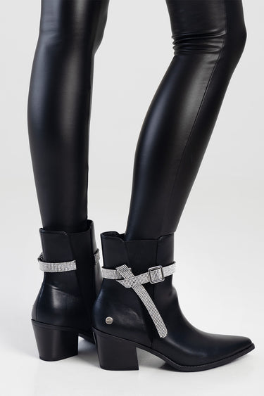 black leather ankle boots with a low block heel and silver rhinestone straps around the ankle