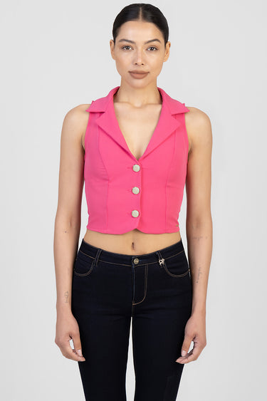 pink sleeveless cropped waistcoat by Blue Jean Traders with wide lapels and four gold buttons over dark denim jeans