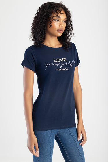 woman wearing a navy blue short sleeve tee with the words love yourself and sissyboy on the chest