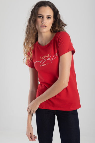 woman wearing a red short sleeve crew neck top with a glittery love yourself graphic on the chest