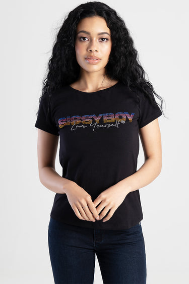 woman wearing a black short sleeved top with a multicoloured rhinestone graphic across the chest