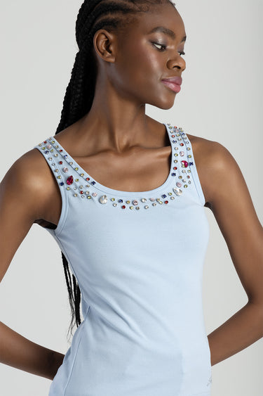 light blue knit vest with multicolour jewel embellishments around the scoop neckline on a model