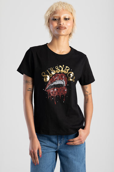 woman wearing a black short sleeve top with a glittery red lips graphic on the front