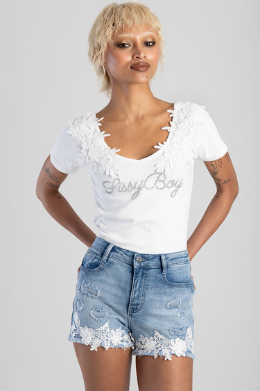 white short sleeve top with floral lace around the neckline and shoulders, rhinestone script on chest, paired with light