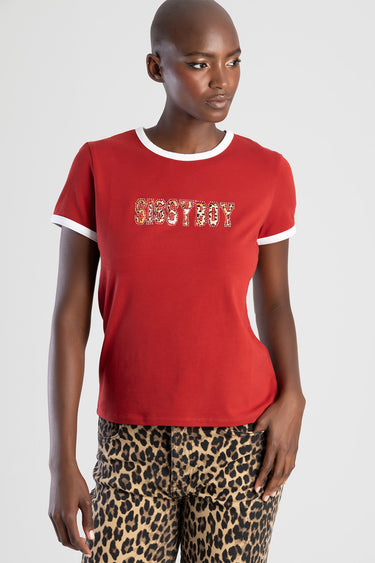red short sleeve top with white trim at neck and sleeves, rhinestone letters reading SISSYBOY, paired with leopard print