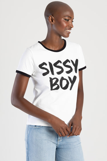 woman wearing white short sleeve t shirt with black trim and graphic text sissy boy and light blue denim jeans