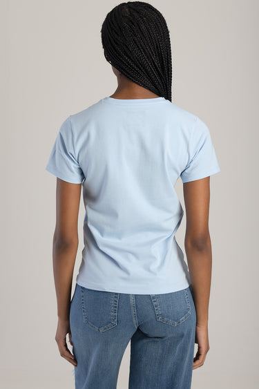 back view of a light blue short sleeve t shirt by blue jean traders worn with blue jeans
