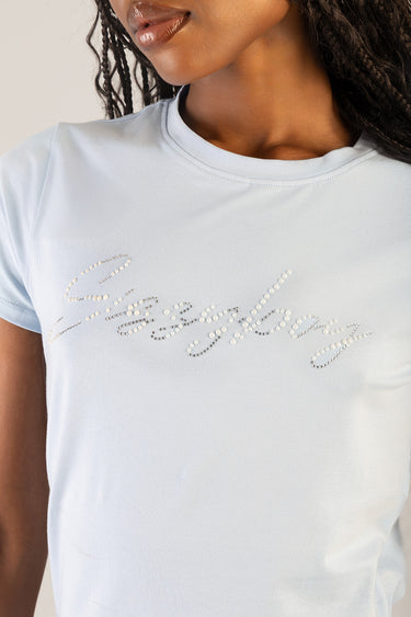 light blue short sleeve t shirt with rhinestone script across the chest