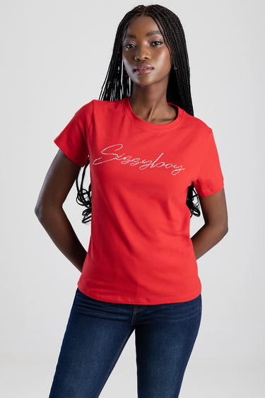 red short sleeve t shirt with a rhinestone script logo on the chest, model wearing dark blue jeans