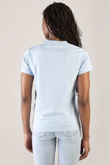 back view of a light blue short sleeve top paired with light wash jeans by Blue Jean Traders