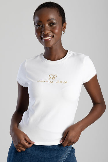 smiling woman wearing white short sleeve crew neck top with gold script logo on the chest, paired with blue jeans